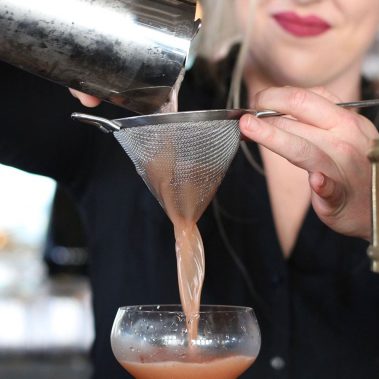bartender pouring a drink