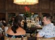 two people sitting at a bar
